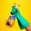 person-holding-yellow-and-white-labeled-bottle-3989284